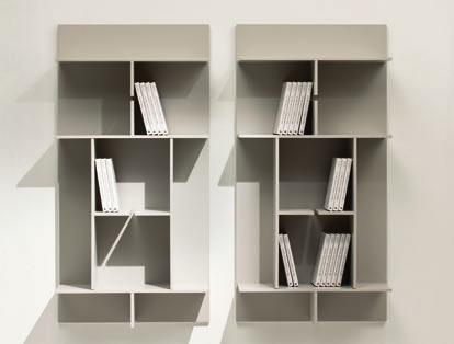 Modular wall bookcase with structure veneered canaletto walnut or fiberboard. It is possible to hang it vertically or horizontally.