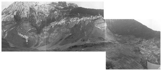 Figura 5 - La pendice del Monte Toc su cui è scivolata la frana e, a destra, il materiale accumulato in prossimità della diga (Foto Annovi, 1975) La massa
