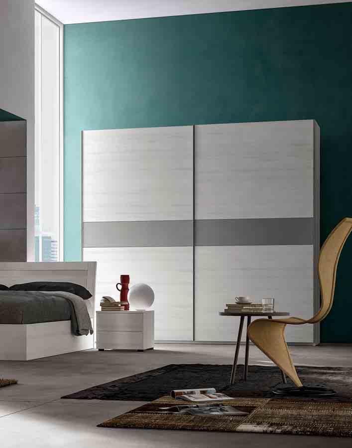 Il letto Dodo e l armadio scorrevole entrano nella composizione e portano nuove geometrie in camera da letto. La linearità fa da cornice al design.