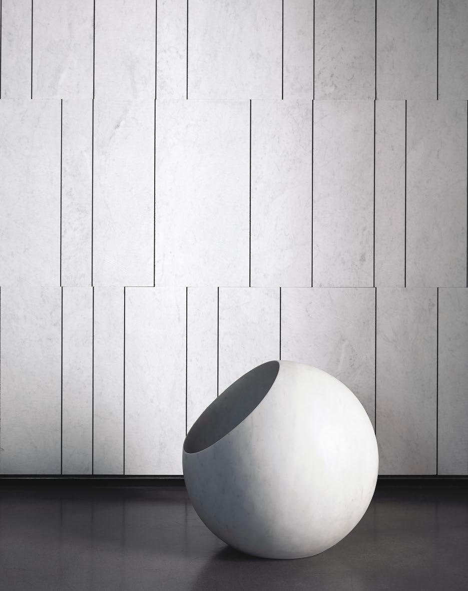 Urano 50 Urano by Elisa Ossino Urano, designed by Elisa Ossino, is a gorgeous sphere carved out of a cube of Bianco Carrara, shedding a soft and romantic light.