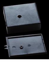 QT SERIES Case suitable to house electronic circuits and transformers, similar to RT. The case, with its own cover, is provided with a central mounting hole.