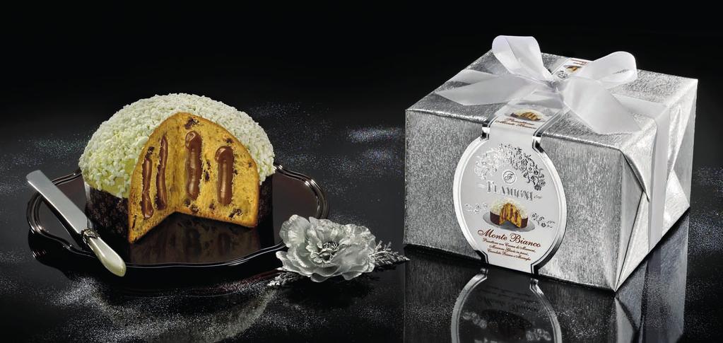 Linea Oro Il Panettone Montebianco Un nuovo scintillante incarto per una nuova golosa ricetta: un profumato impasto con crema ai marroni e marrons glacés in pezzi, ricoperto di cioccolato bianco e