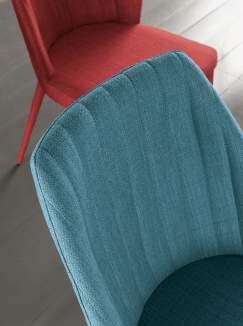 Chair with metal structure totally covered with stain resistant fabric