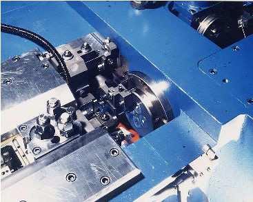 A unique feature of these machines is the utilization of rotating die block, on which are installed 4 dies at 90, and three stationary punches.