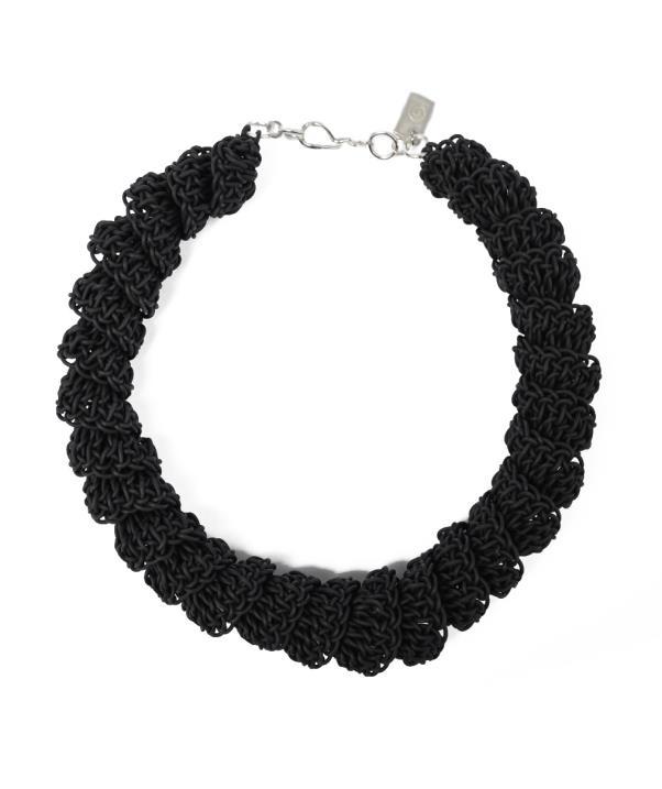 short necklace with small PVC spirals that are repeated around