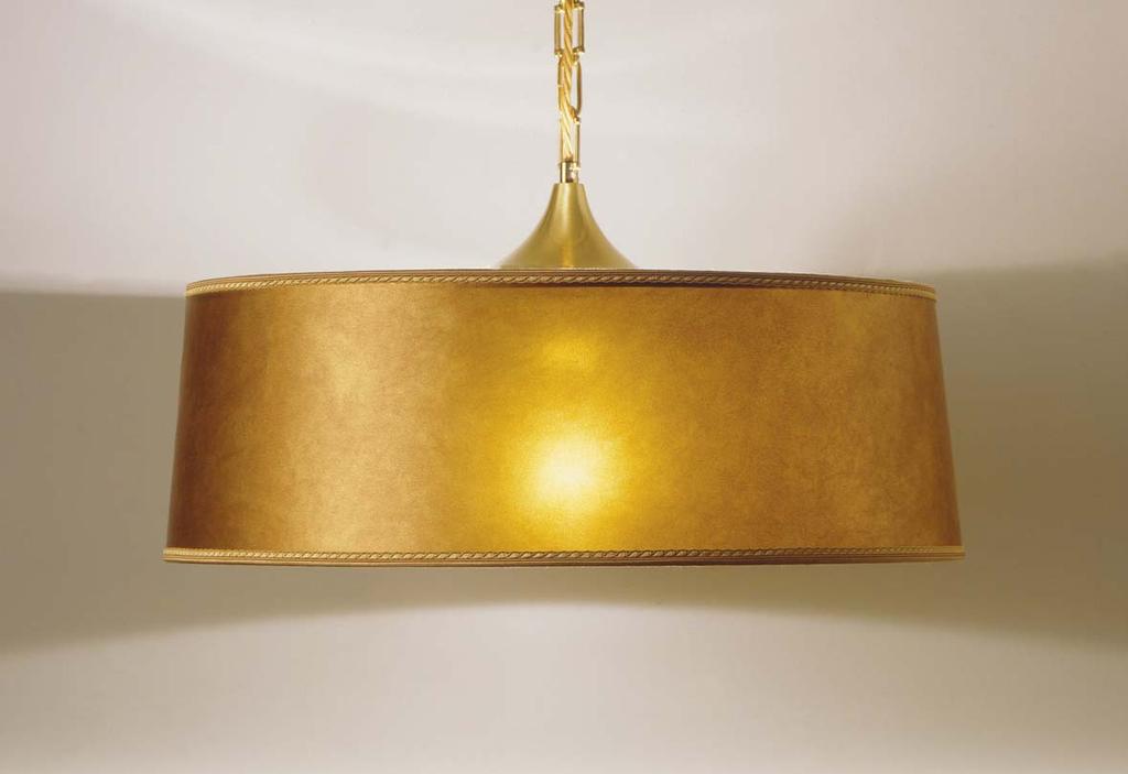 Chandelier made of brass with shade made of old yellow coloured parchement-like tissue.