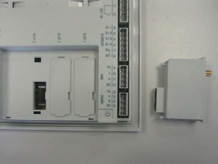 Replace the terminal block and the terminal cover. 6. Power up the system (the base product will automatically recognize the expansion unit).