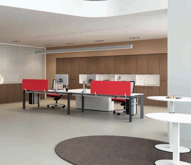 The single desk with extension and modesty panel is flanked by a double-seat desk with frontal panels in red colour and