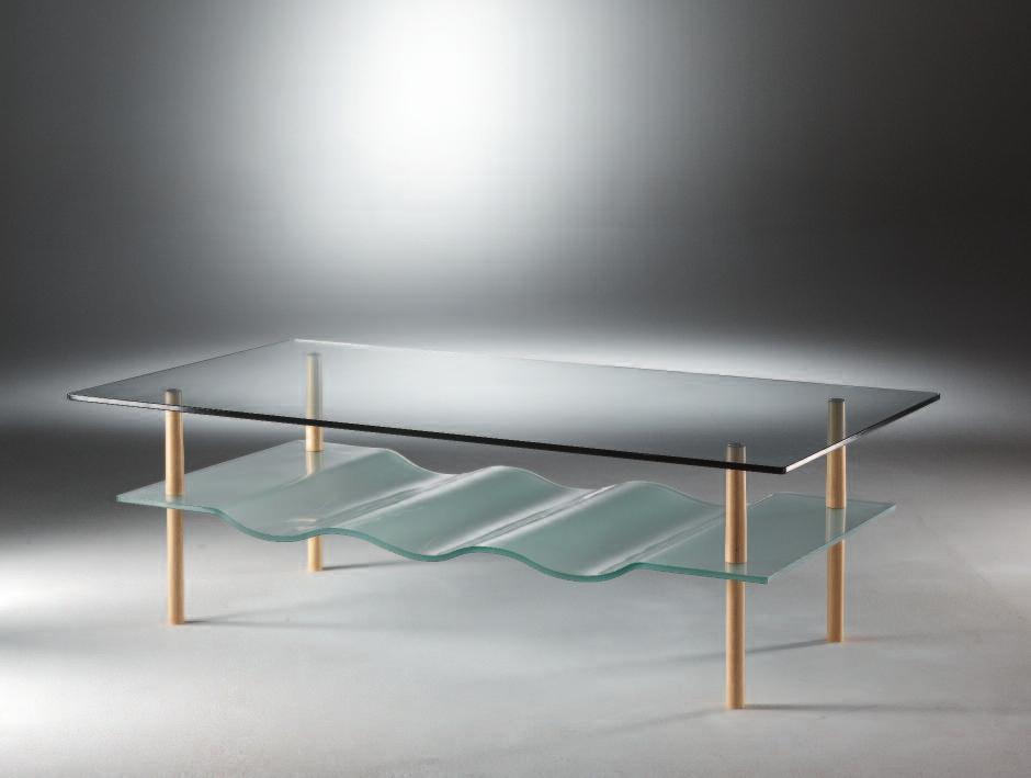Low table with top surface in transparent glass and bottom surface in bent sandblasted glass; supports in natural beech-wood. Art.