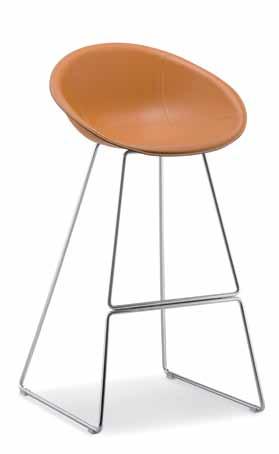 Gliss chair covered with genuine leather with clear stitches.