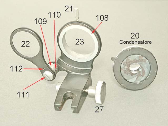 Fig. 2415 Sfilato dalla coda di rondine 100, la squadra portacondensatore 23 è formata da un pezzo verticale, con la femmina della coda di rondine, e da un anello orizzontale (23) in cui è centrabile