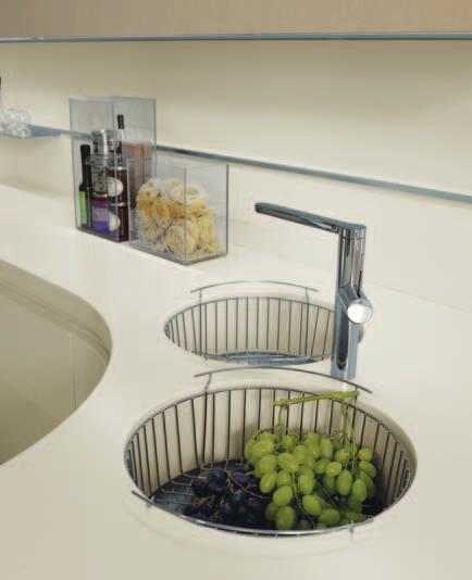 Flush built-in hob, Corian and stainless steel sink bowls.
