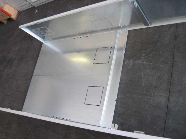 Assemble the 2 vertical back side panel sections, with 3 screws M5x10 (EN 7045) (the bottom side facing the ground is identified by the provisions for the two rectangular openings,