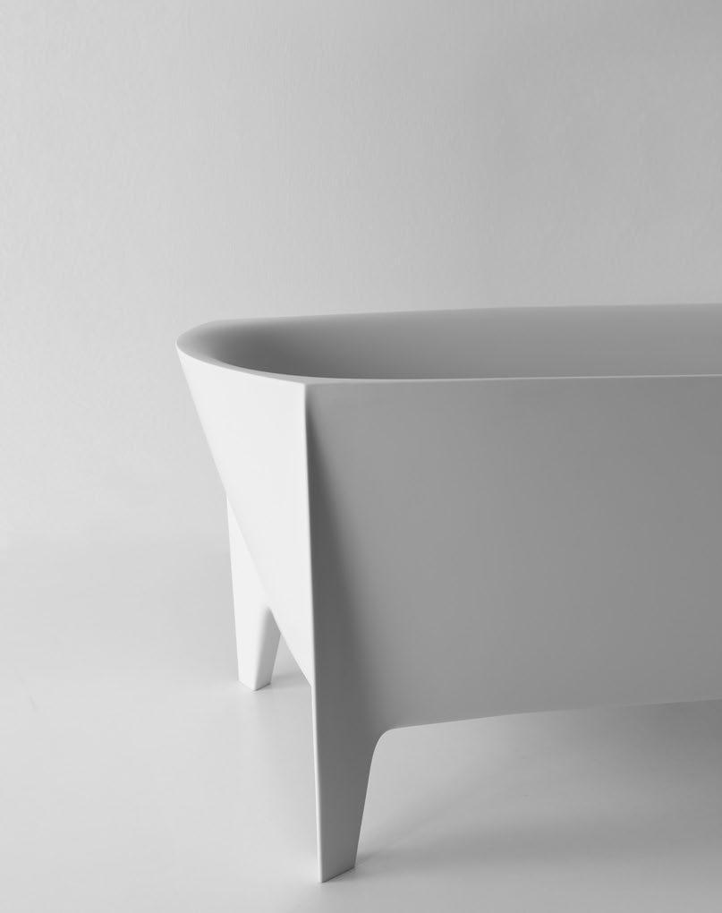 EDONIA design Mario Ferrarini Una forma inedita, una base rettangolare che viene plasmata e stirata per modificarne la percezione e rendere meno statica la composizione.