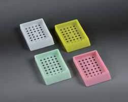 They are made in acetal resin, with removable lid and writing surface. Dim. 41.5 x 28.5 x 6 mm.