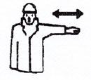A SINISTRA rispetto al segnalatore Il braccio sinistro, teso più o meno in orizzontale, con la palma della mano sinistra rivolta verso il basso, compie piccoli movimenti lenti nella direzione