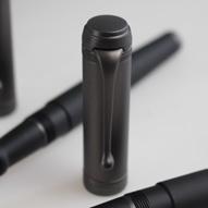 solid gold nib, black rhodium treated. Cap in satin ruthenium and body in satin black resin.