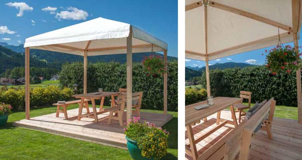 Gazebo quadrato in kit di montaggio Dimensioni cm 327 x 327 x 240/320 h In lamellare larice alpino Montanti cm 9 x 9 Travi cm 9 x 9 Arcarecci cm 7 x 9 Ancoraggi a pavimento non incluso Ferramenta per