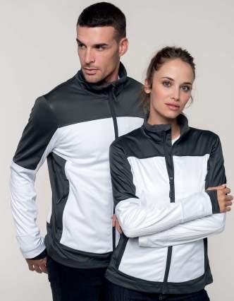 K415-416 - SOFTSHELL BICOLORE UOMO/DONNA DESCRIZIONE 3 strati di tessuto Softshell. Vestibilita aderente. Polsini con foro per il pollice.