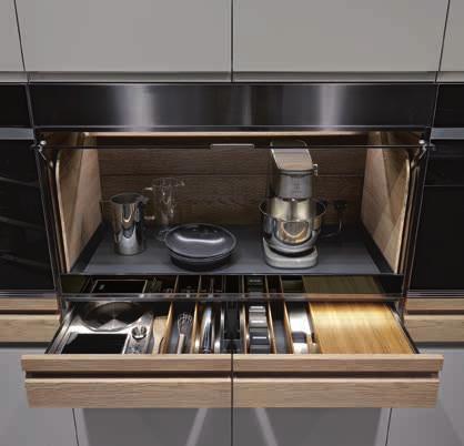 Detail of MAC (Mini Appliances Container), with NTF fossil oak lining, built-in lighting, electric sockets, pull-out tray, frame in steel and Stopsol glass.